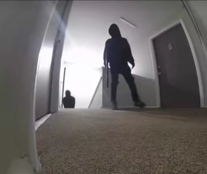 Family home targeted by armed intruders. They manage to kick in the door, but the man shoots back and tells his wife to call the police